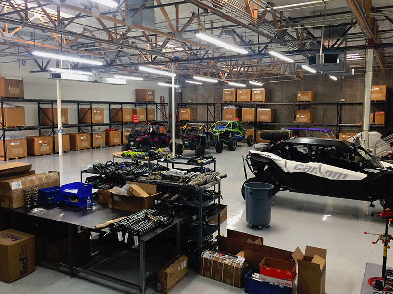 Shock Therapy Warehouse with UTVs and Lots of Brown Boxes